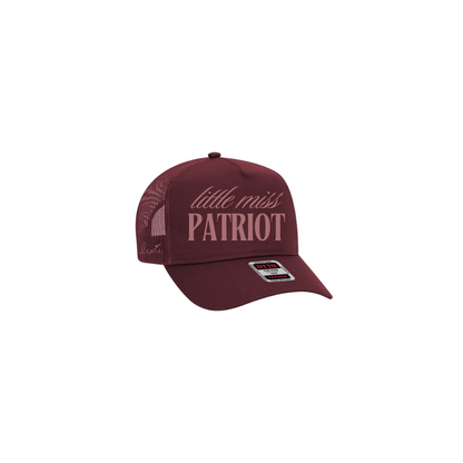 Maroon hat with mauve text that reads "little miss patriot". Lexie's signature is embroidered on the side