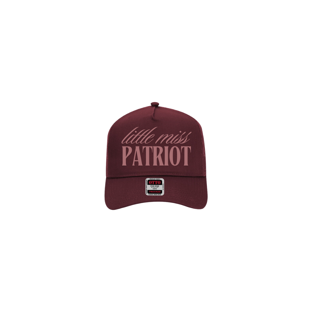 Maroon hat with mauve text that reads "little miss patriot". Lexie's signature is embroidered on the side