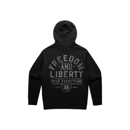 Back view of a black hoodie with grey distressed letters. The whole wording is "Freedom and Liberty over Everything" The word freedom is arched across the back. and the other words are nested underneath FREEDOM. The bottom has a USA logo and "official patriot gear" as well as the roman numerals for 2020 (when OPG was founded). 