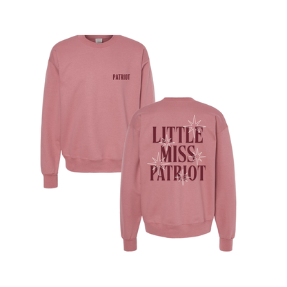 Pink crewneck with magenta patriot logo on the left chest and Little Miss Patriot with stars on the back. Lexie's signature is  embroidered on the sleeve. 