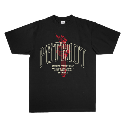 Black oversized T-shirt from Official Patriot Gear, featuring a bold collegiate-style "PATRIOT" graphic with a red torch illustration in the background. Below the main text, there is a slogan that reads "OFFICIAL PATRIOT GEAR – FREEDOM AND LIBERTY OVER EVERYTHING – EST MMXX" in white, centered on the front. The T-shirt has a classic crew neck and short sleeves.